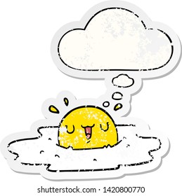 cartoon fried egg with thought bubble as a distressed worn sticker