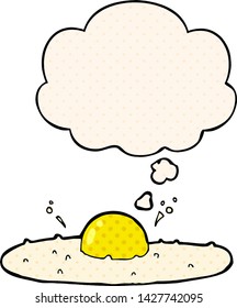 cartoon fried egg with thought bubble in comic book style