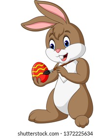 Cartoon funny Easter Bunny painting an egg