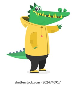 Cartoon funny and happy crocodile in a yellow rain coat. Aligator wearing clothing. Vector illustration isolated. Anthropomorphic.