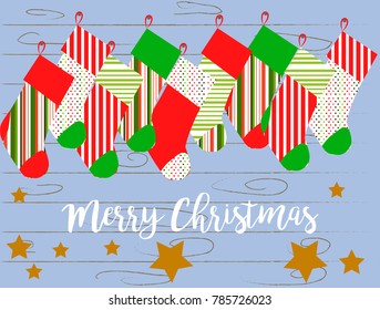 Cartoon gift socks on a background of blue boards with an inscription Merry Christmas - Vector Illustration eps 10