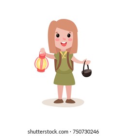 Cartoon girl scout holding red coleman lantern and black cauldron in hands svg