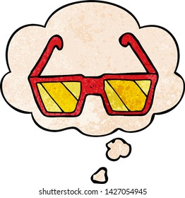 cartoon glasses with thought bubble in grunge texture style