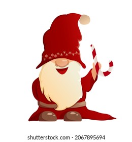 A cartoon gnome holds a caramel in his hand. A dwarf in New Year's clothes, in a Santa hat. Vector character isolated on white background.