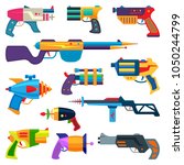 Cartoon gun vector toy blaster for kids game with handgun and raygun of aliens in space illustration set of child pistols and laser weapon isolated on white background
