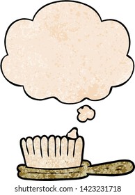 cartoon hairbrush with thought bubble in grunge texture style