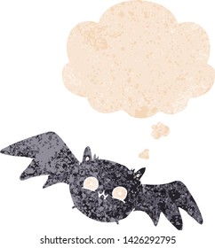 cartoon halloween bat with thought bubble in grunge distressed retro textured style