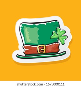 cartoon hand drawn saint patriks hat isolated on orange background. st. patriks day sticker