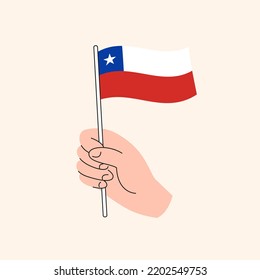 Cartoon Hand Holding Chilean Flag Icon, The Flag of Chile, Concept Illustration. Flat Design Isolated Vector.