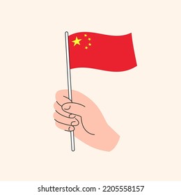 Cartoon Hand Holding Chinese Flag, The Flag of China, Concept Illustration. Flat Design Isolated Vector.