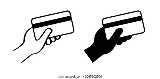 Cartoon hand holding a credit card icon or symbol. Vector payment pictogram. Contactless card. Pay cards. Plastic cards payments in hand. Web sign