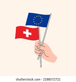 Cartoon Hand Holding European Union And Swiss Flags. EU Switzerland Relationships. Concept of Diplomacy, Politics And Democratic Negotiations. Flat Design Isolated Vector