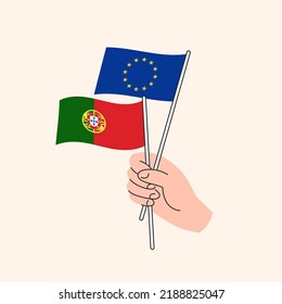 Cartoon Hand Holding European Union And Portuguese Flags. EU Portugal Relationships. Concept of Diplomacy, Politics And Democratic Negotiations. Flat Design Isolated Vector