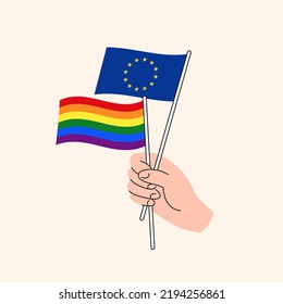 Cartoon Hand Holding European Union And LGBTQ Rainbow Flags. EU and LGBT Minorities Relationships. Concept of Freedom of Love, Speech and Human Rights. Flat Design Isolated Vector