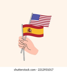 Cartoon Hand Holding United States And Spanish Flags, US Spain Relationships. Concept of Diplomacy, Politics And Democratic Negotiations. Flat Design Isolated Vector