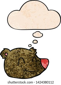cartoon happy bear face with thought bubble in grunge texture style