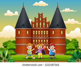 Cartoon of Happy school children standing in front of Holstentor building