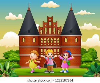 Cartoon of Happy school children standing in front of Holstentor building