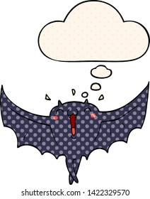 cartoon happy vampire bat with thought bubble in comic book style