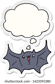 cartoon happy vampire bat with thought bubble as a printed sticker