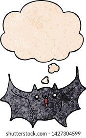 cartoon happy vampire bat with thought bubble in grunge texture style