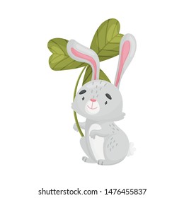 Cartoon hare with clover. Vector illustration on white background.