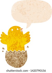 cartoon hatching bird with speech bubble in grunge distressed retro textured style