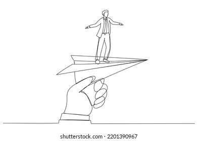 Cartoon of huge hand holding paper plane and take off with businessman. Continuous line art style
