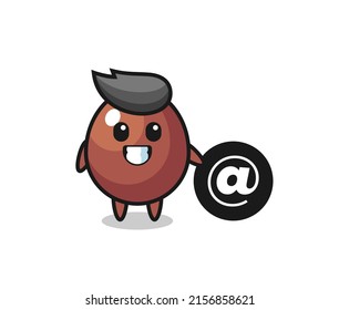 Cartoon Illustration of chocolate egg standing beside the At symbol , cute design
