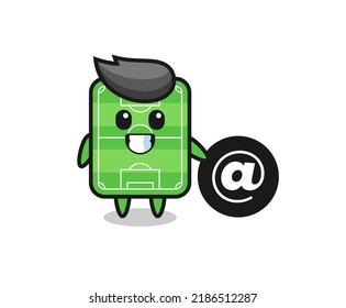 Cartoon Illustration of football field standing beside the At symbol , cute style design for t shirt, sticker, logo element