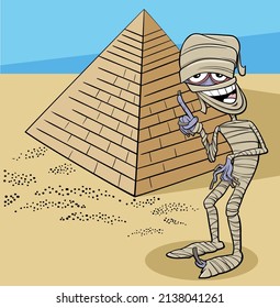 Cartoon illustration of funny mummy character and pyramid in the desert 
