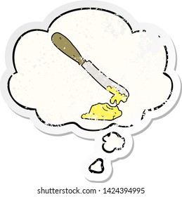 cartoon knife spreading butter with thought bubble as a distressed worn sticker