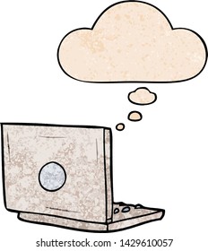 cartoon laptop computer with thought bubble in grunge texture style