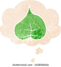 cartoon leaf with thought bubble in grunge distressed retro textured style