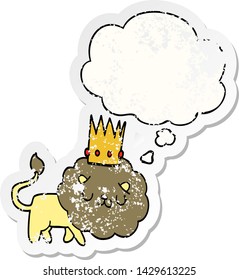 cartoon lion with crown with thought bubble as a distressed worn sticker
