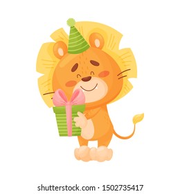 Cartoon lion cub holding a present. Vector illustration on a white background.