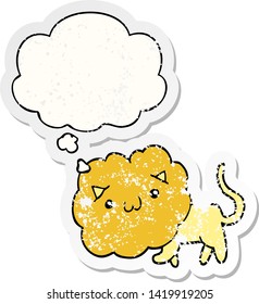 cartoon lion with thought bubble as a distressed worn sticker