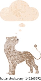cartoon lioness with thought bubble in grunge distressed retro textured style