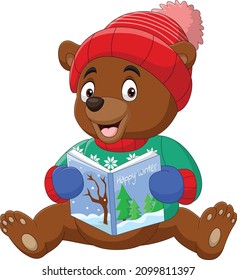 Cartoon little bear in winter clothes reading a book