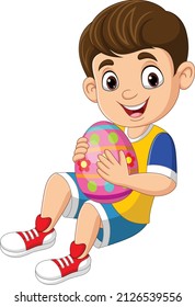 Cartoon little boy holding an easter egg