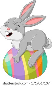 Cartoon little bunny with easter egg