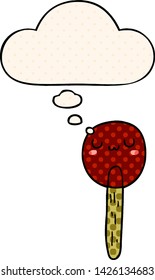 cartoon lollipop with thought bubble in comic book style