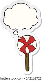 cartoon lollipop with thought bubble as a printed sticker