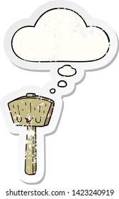 cartoon mallet with thought bubble as a distressed worn sticker