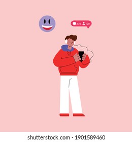 Cartoon man checking comments and new followers on social media - teenager in headphones looking at smartphone screen and smiling. Flat isolated vector illustration.