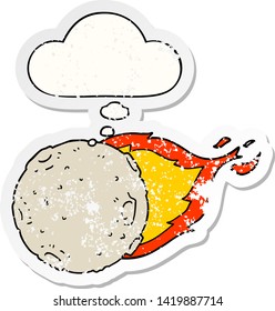 cartoon meteorite with thought bubble as a distressed worn sticker