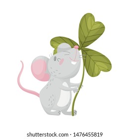 Cartoon mouse with clover. Vector illustration on white background.