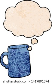 cartoon mug with thought bubble in grunge texture style