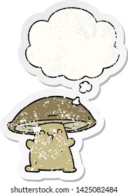 cartoon mushroom character with thought bubble as a distressed worn sticker