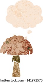 cartoon mushroom with thought bubble in grunge distressed retro textured style